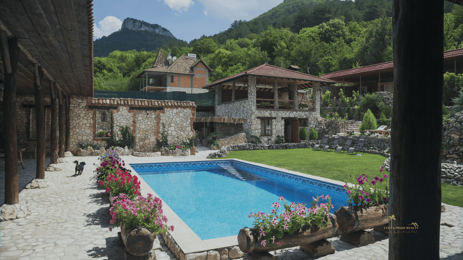 Stone holiday rental villa with swimming pool in the mountains of Spain, typical short-term rental property investment