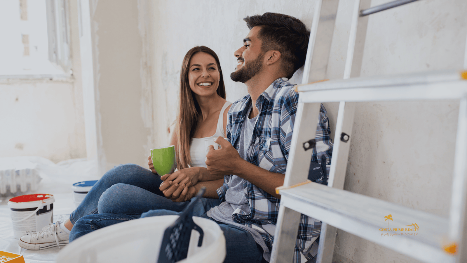 Happy couple enjoying their new home after buying property in Spain