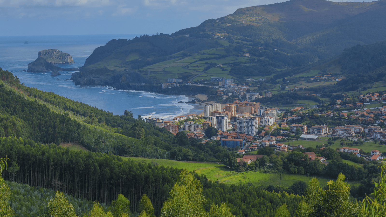 Green coastline and coastal town in the Basque Country northern Spain near the Atlantic Ocean