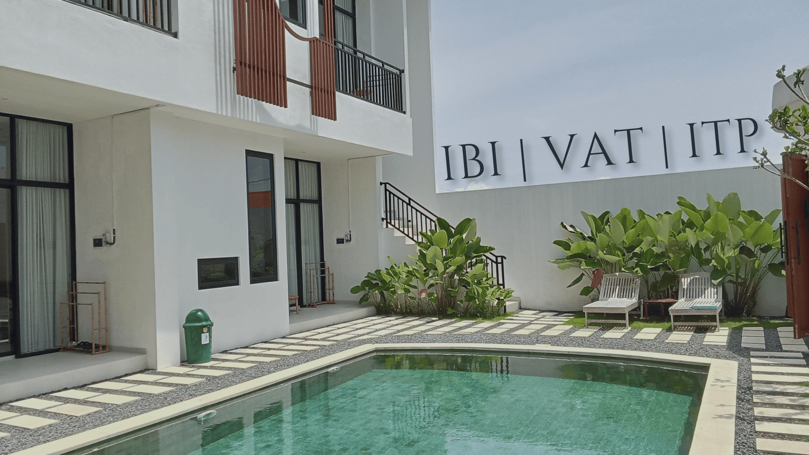 Modern villa courtyard with swimming pool illustrating property taxes in Spain: IBI, VAT and ITP in Andalusia and the Costa del Sol
