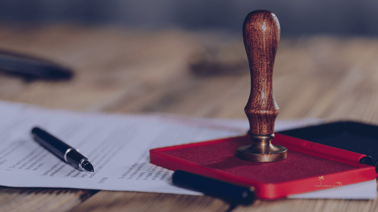 Notary stamp and signed documents representing property deed signing in Spain