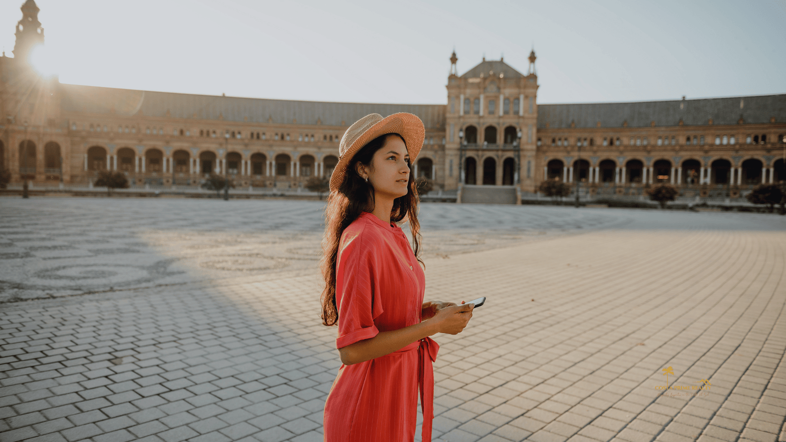 Group of tourists exploring a historic Spanish city while considering moving to Spain.